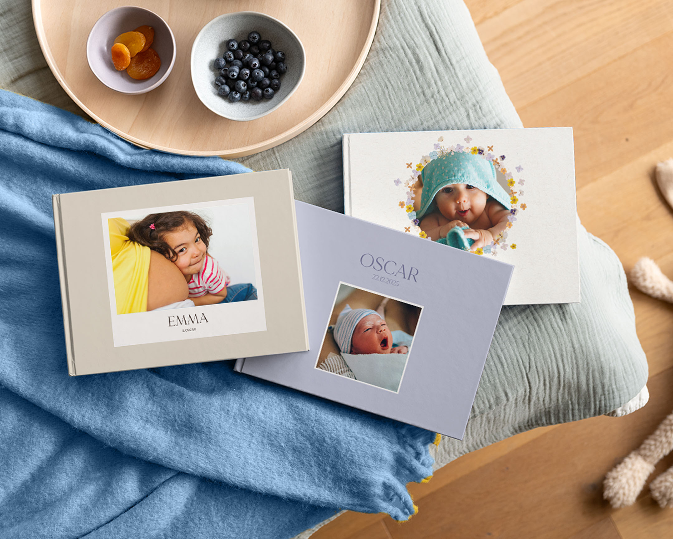 Personalisierte Baby-Fotobücher mit Babybildern auf dem Cover.